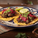 Taco Day promotion featuring two tacos for the price of one at El Santo